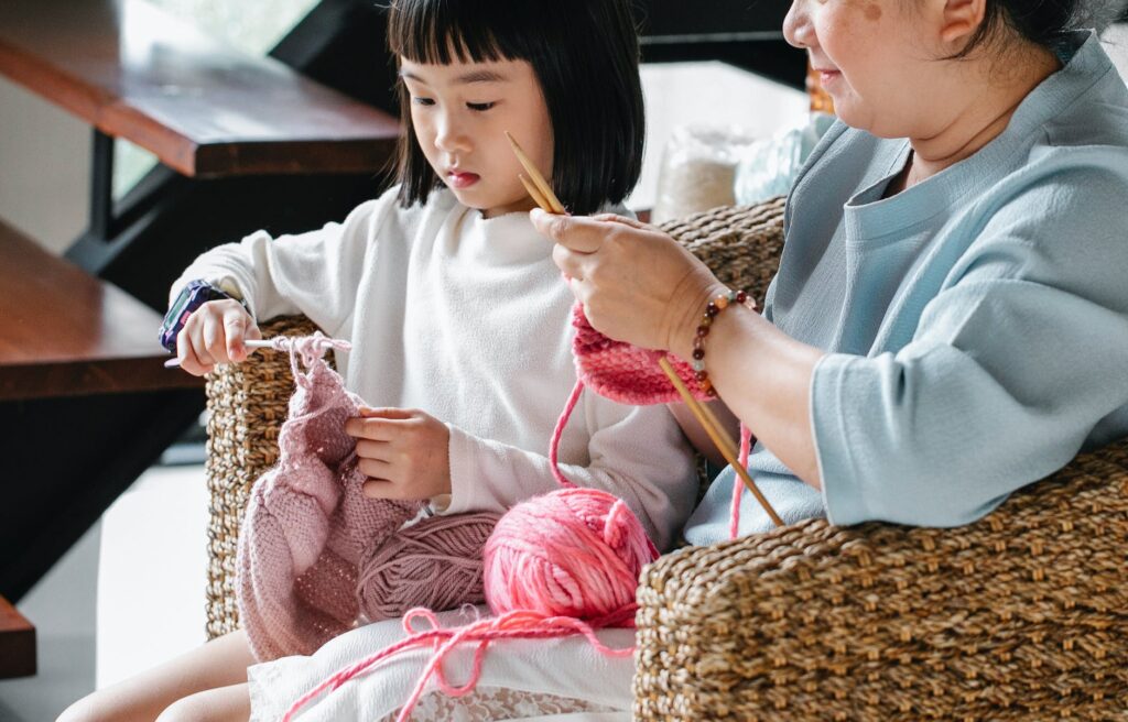 mother and daughter doing crafting activities